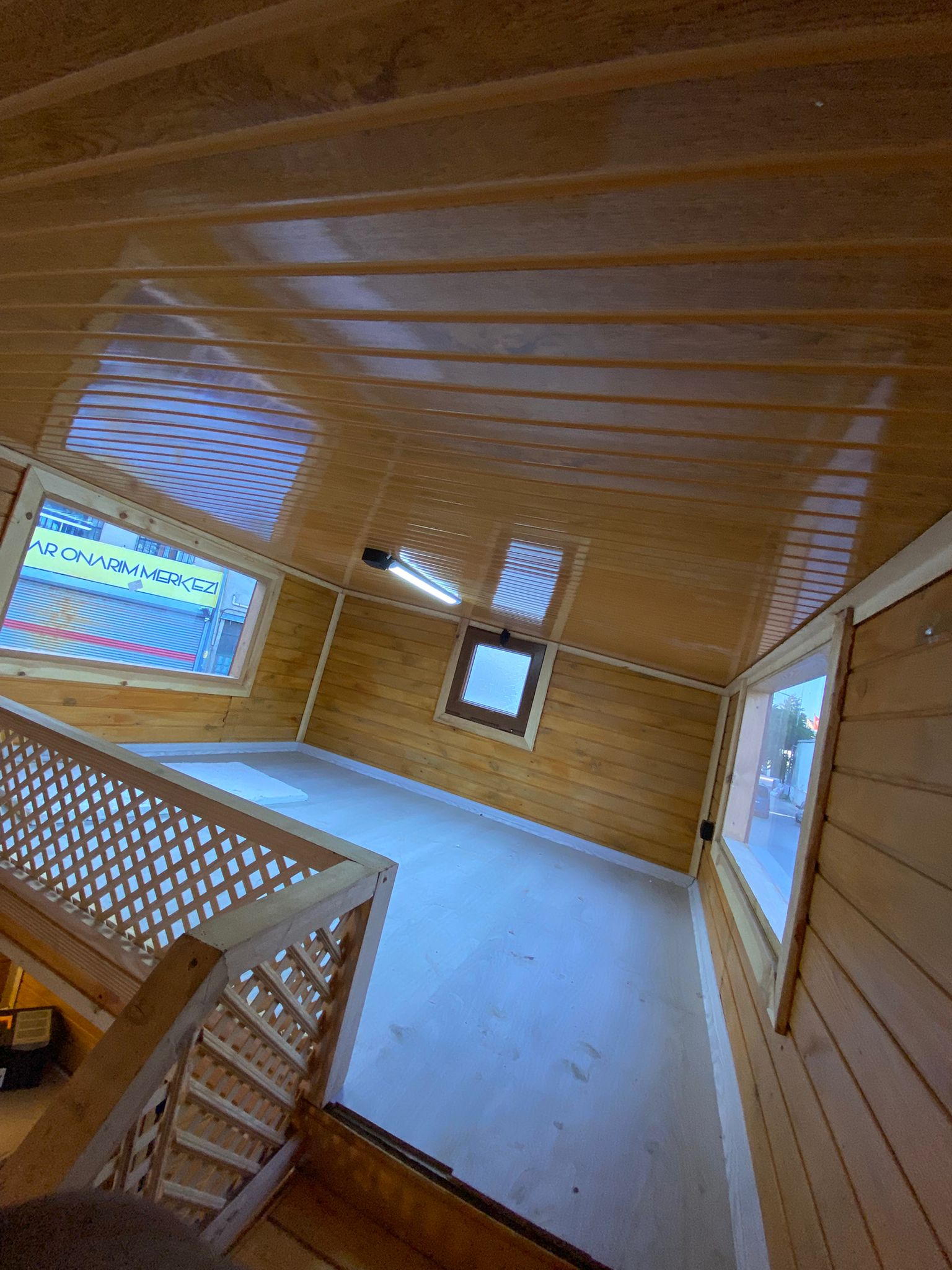Architect reviewing blueprints in a modern office with natural light